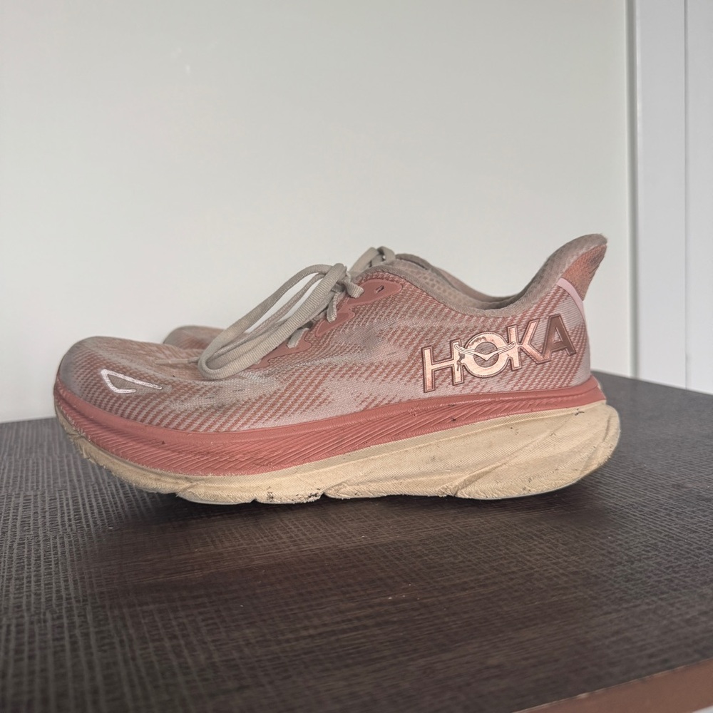 Hoka running shoe in rose and beige tones